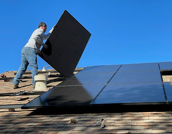 Builder installs=solar panel on home