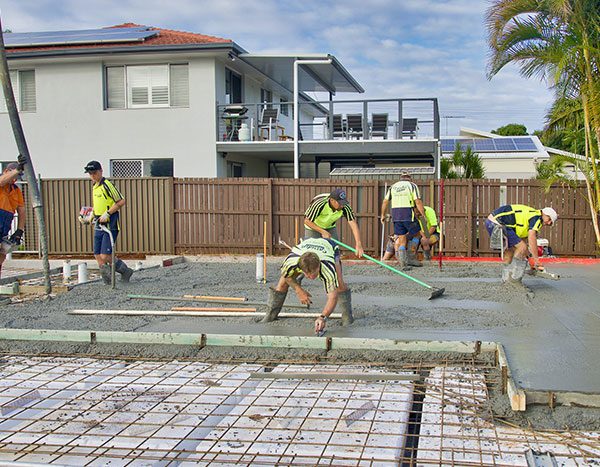 Concrete foundation construction with builders