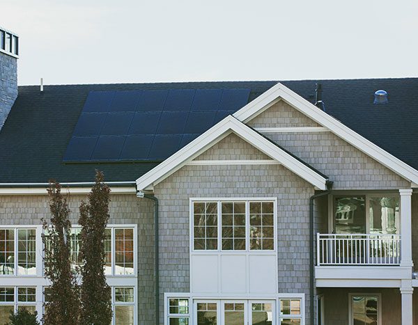 A large home with solar panels on the roof