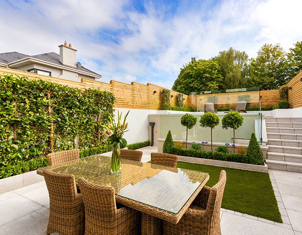 A polished backyard with landscape and hardscape features